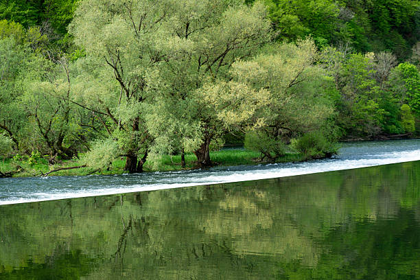 Along the Doubs river in eastern France. The Doubs is a 453-kilometre river in far eastern France which strays into western Switzerland.