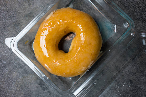 Sweet glazed donut dessert, delightful treat simple and delicious