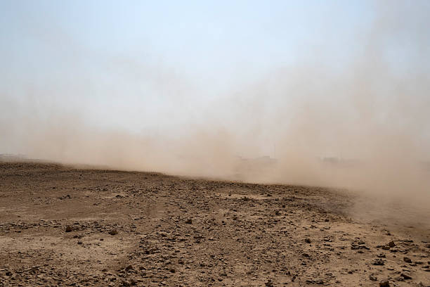 Zikreet, Qatar - November 15, 2025: A large storm formed, powdered dust and sand on the ground were blown into the clouds, causing the orange glow to look horrible. extreme weather events.