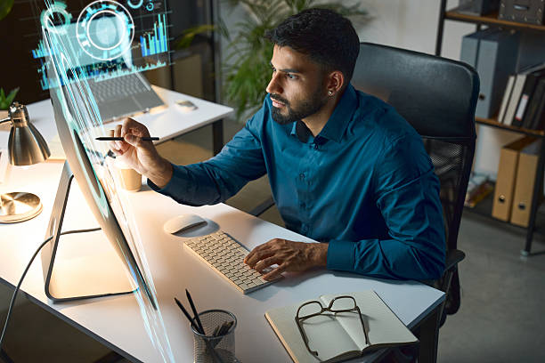 istock Professional Man Working on a Futuristic Digital Touchscreen Interface in Modern Office 2249883914