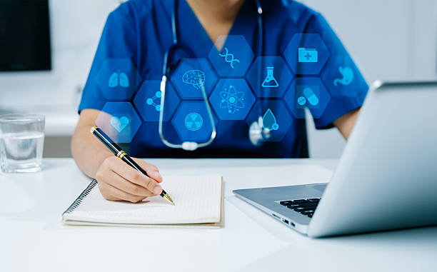 istock Doctor in scrubs writing notes with digital healthcare interface overlay. Concept of futuristic medicine, health tech 2249885891