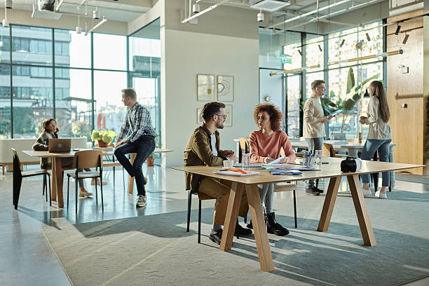 istock Group of young freelancers working in a casual office. 2249887151