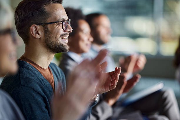 istock Happy entrepreneurs applauding on a seminar in board room. 2249887287