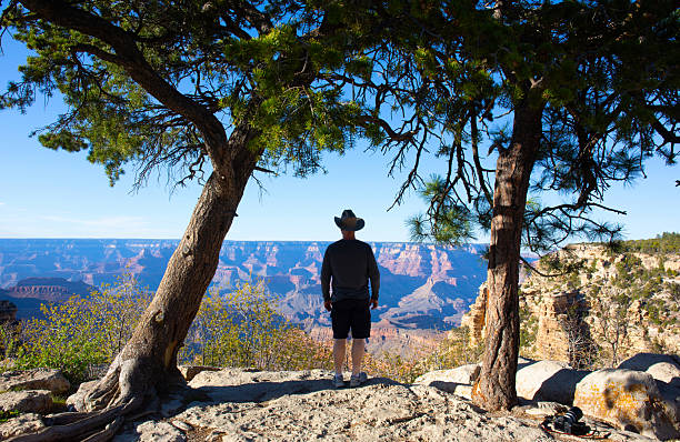 USA Arizona. The Grand Canyon, man with cowboy hat viewing the canyon