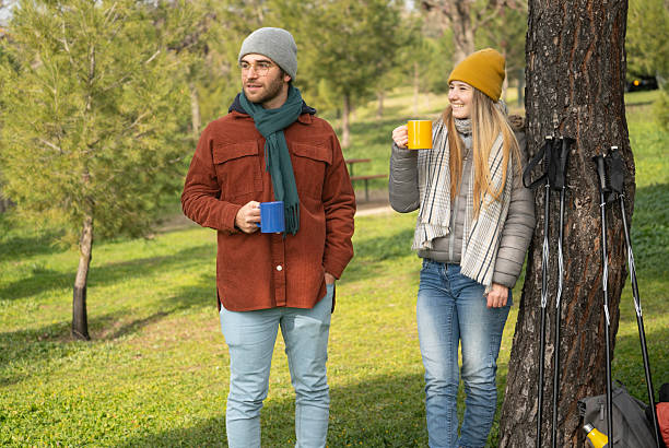 istock Hikers resting and drinking hot beverages in a park 2249890630
