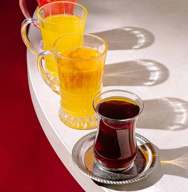 istock Colorful drinks displayed on a table with vibrant shadows in a cozy setting 2249891109