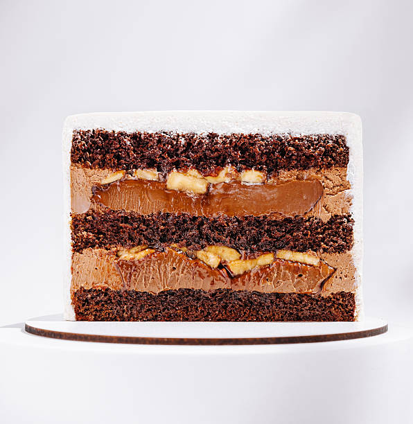 Delicious chocolate and caramel layered cake with banana filling