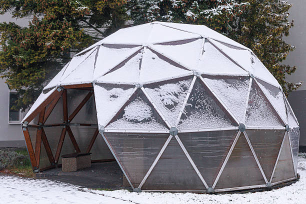 istock A geodesic dome structure covered with fresh winter snow in an outdoor setting. Concept of modern architecture detail, winter design reference and educational STEM visuals. 2249892585