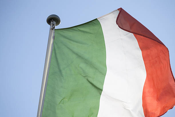 istock Italian flag waving against blue sky representing national identity 2249896474