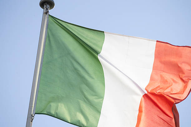 istock Italian flag waving in a clear blue sky 2249896707