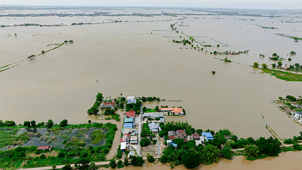 istock Flooding in rural area affects homes and land in daylight 2249896846