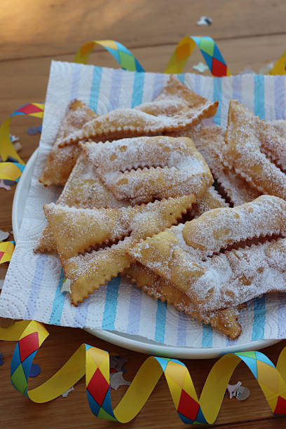 istock Italian sweet crisp pastry deep-fried and sprinkled with sugar on table 2249898171