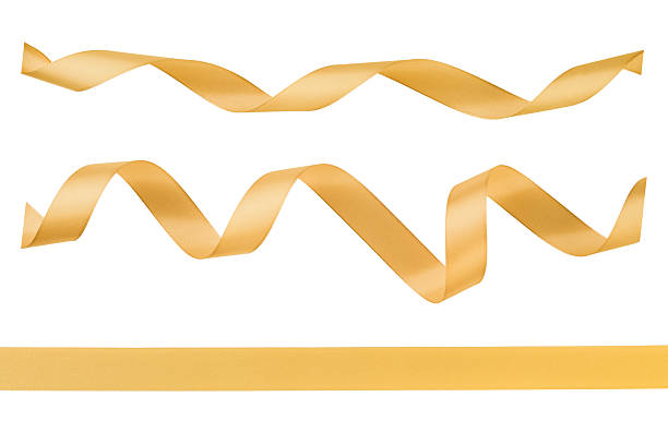 istock Set of gold satin ribbon forming elegant wave like curves and line isolated on white background with clipping path. Design element Christmas gift wrapping, festive decorations, weddings, birthdays. 2249898607