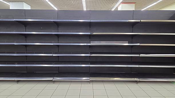 istock Display shelves in the supermarket that are empty because it has ceased operations. 2249898843