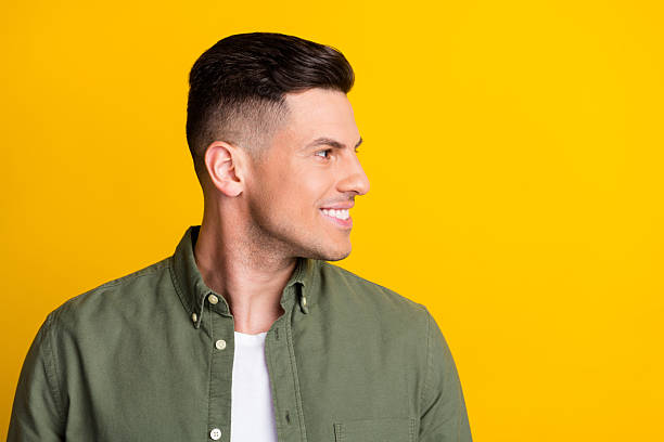 istock Profile side view portrait of attractive content cheerful guy looking aside copy space isolated over bright yellow color background 2249898919