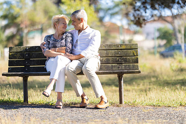 istock Senior couple sharing a loving moment in park 2249902856
