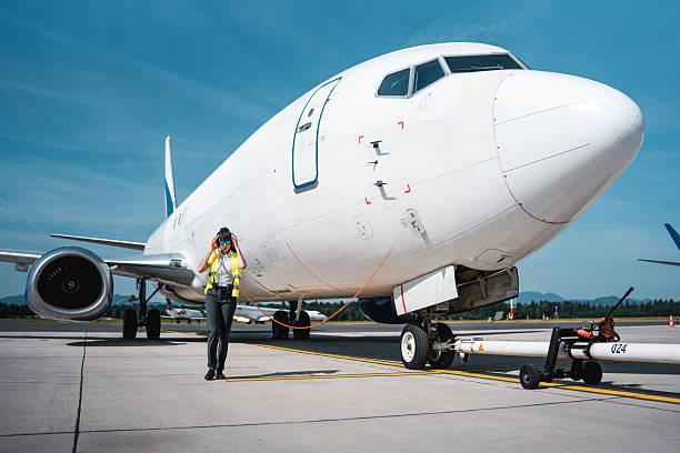 istock Ground Crew Member Walking Near Cargo Jet During Preflight Check 2249905898