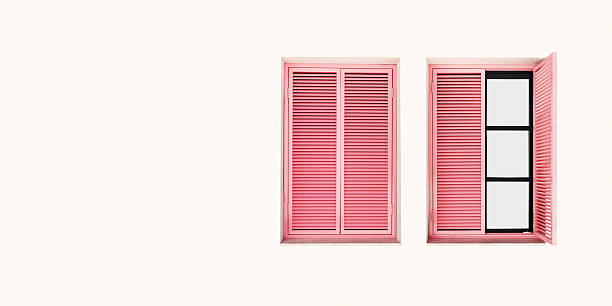 istock Two Windows frames on light pink minimal wall with pink wooden shutters, modern home facade design, banner with copy space. Contemporary photography pastel aesthetics, vintage creative backgrounds. 2249906166