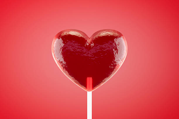 istock Valentine's Day, heart shaped lollipop on red background 2249907357