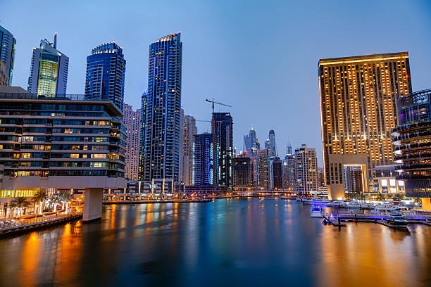 Dubai, UAE. September 27, 2023: mirror panoramic view of Dubai Marina sandy beach in the frame in the foreground