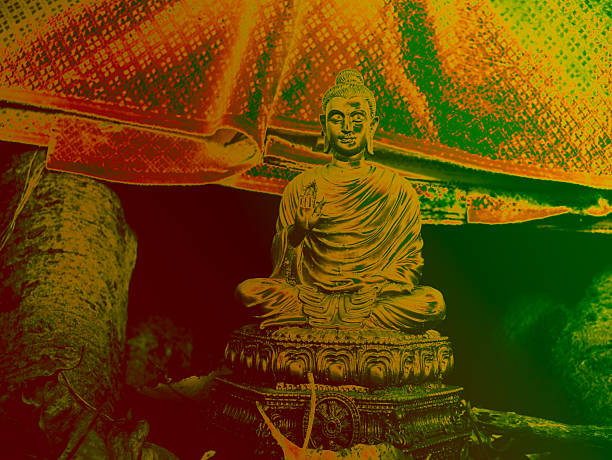 istock Golden Bronze Buddha Statue in Meditation Pose with Blessing Hand Gesture Under Yellow Umbrella Outdoors 2249907670