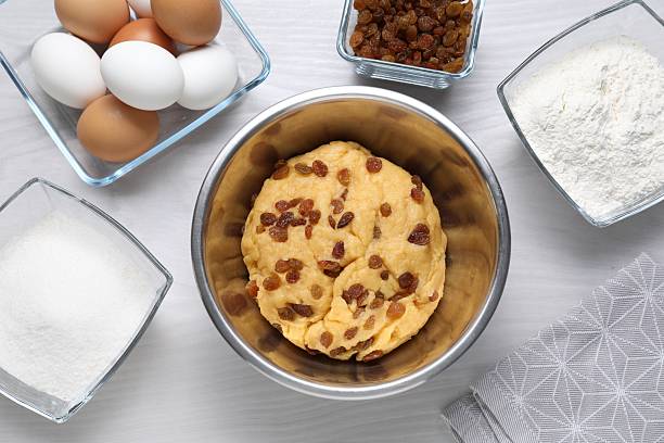 Ingredients for homemade dough, semisweet dough with raisins, honey and  various seeds. Homemade bread preparation. Top view.