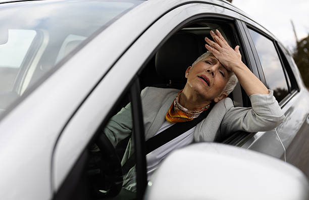 istock Older woman in traffic jam late for work 2249909137