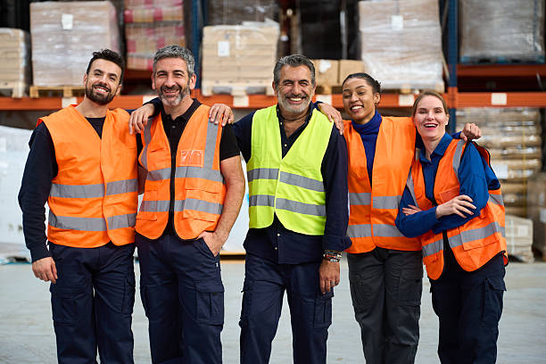 istock Diverse warehouse workers team smiling in a group portrait 2249913847