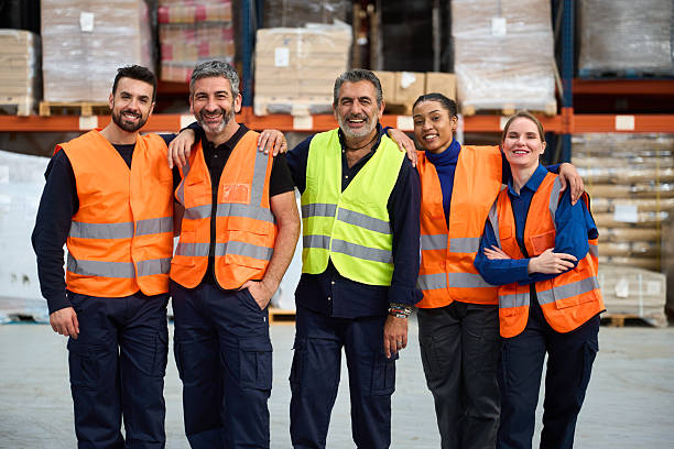istock Diverse warehouse workers team smiling in logistics center 2249913848