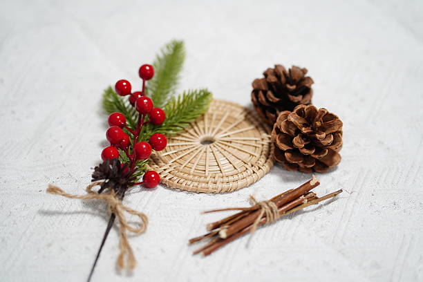 istock Natural Elements for Holiday Decoration Including Pine Cones, Berries, Greenery, and Rattan on Light Wood Background 2249915170