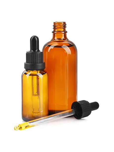 istock Glass bottles and pipette with tincture isolated on white 2249915753