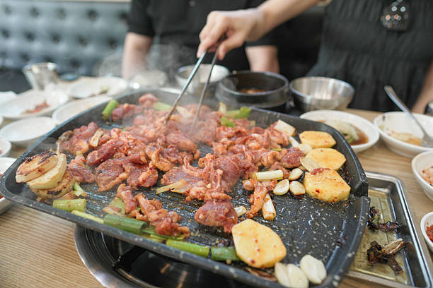 istock A person is cooking meat on a grill 2249916243