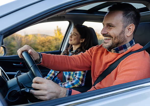 istock Couple enjoying a scenic drive through nature 2249916464