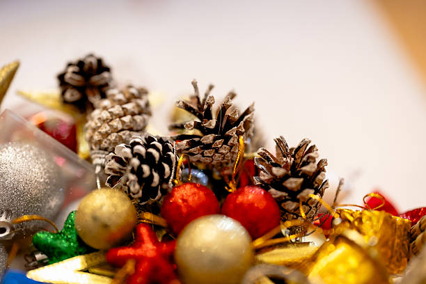 istock Putting on a christmas tree ornament close up 2249916536