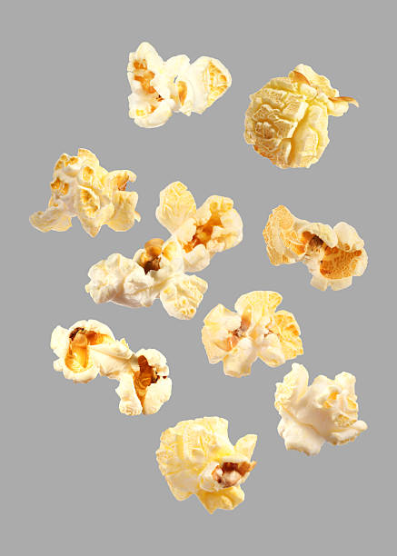 istock Tasty fresh popcorn flying on grey background 2249916965