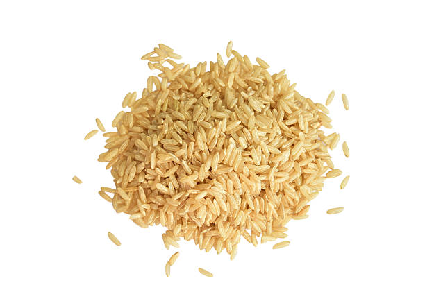 A pile of brown rice isolated on a white background.