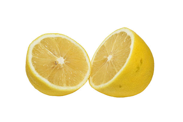 Two halves of one lemon isolated on white background.