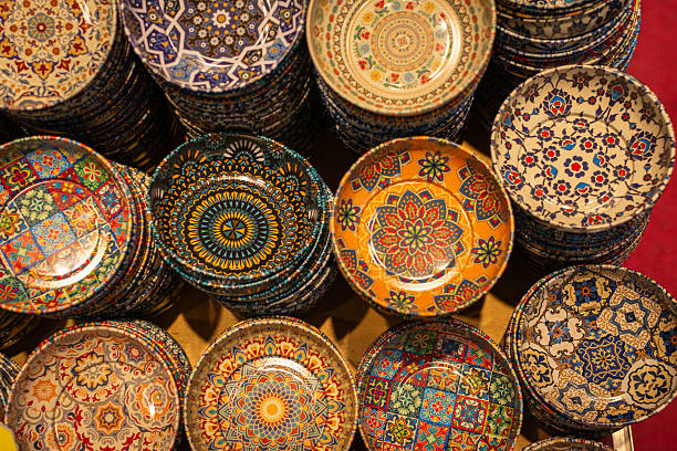 istock Vibrantly patterned ceramic plates for sale at a Global Village Dubai stall. 2249918902