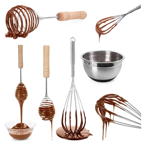 Whisks with chocolate cream isolated on white, set