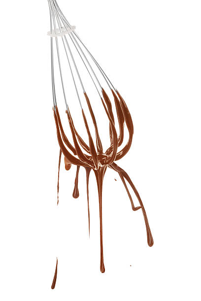 Whisk with chocolate cream on white background