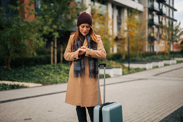 istock Woman checking time while waiting urban street journey 2249919771