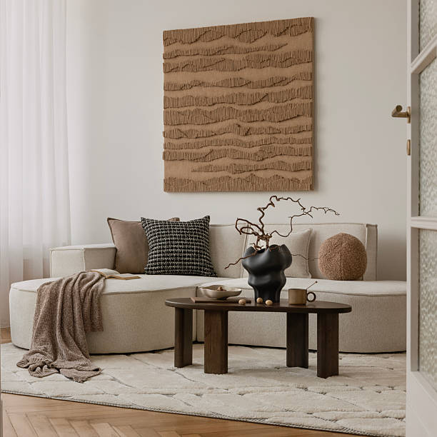 istock Earthy modern interior with round sofa, minimal coffee table, and large textured wall art in a soft natural palette. 2249921882
