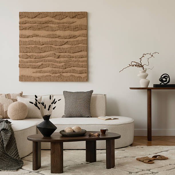 istock Minimalist living room with neutral tones, textured wall art, and modern decor elements. Cozy and stylish interior design inspiration. 2249921895