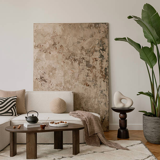istock Stylish coffee table scene with a ceramic teapot, nuts, and a cozy wool rug. Warm textures and earthy tones for a relaxing space. 2249921905
