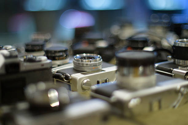 istock Retro film camera, close-up, back view, on black background. 2249928696