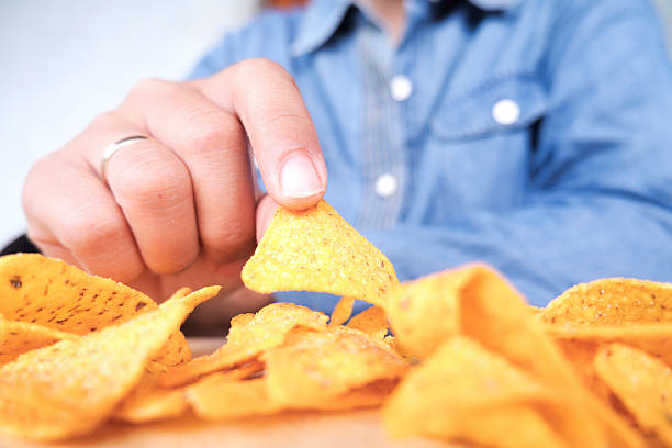 istock Close Up of Snack Grabbed by Hand 2249928754