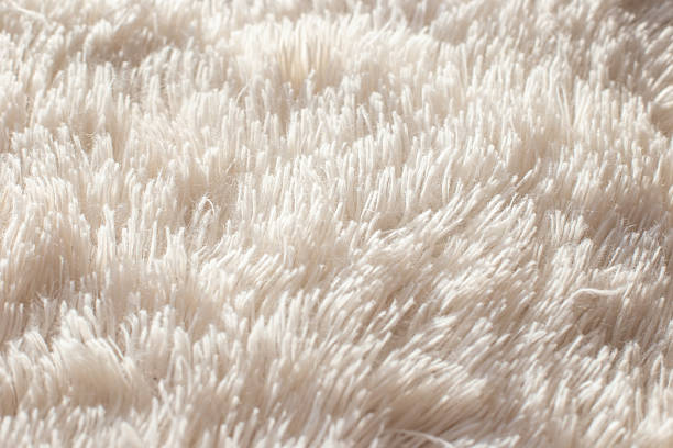 istock Texture of fluffy white artificial plaid, close up 2249929906