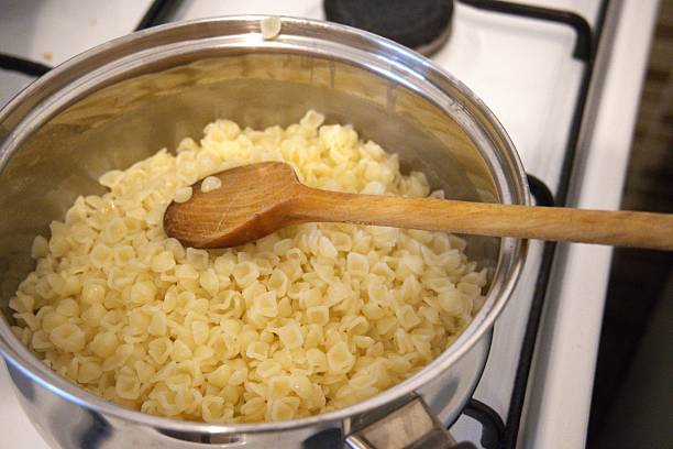 istock Cooked Small Shell Pasta in Cooking Pan in Close-Up Homemade 2249932746