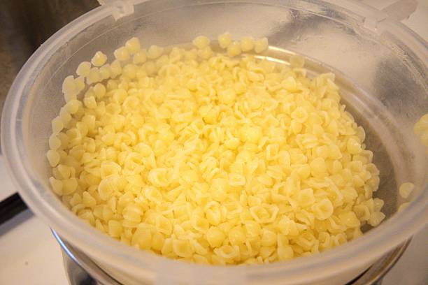 istock Small Shell Pasta in White Plastic Strainer in Close-Up Homemade 2249932749