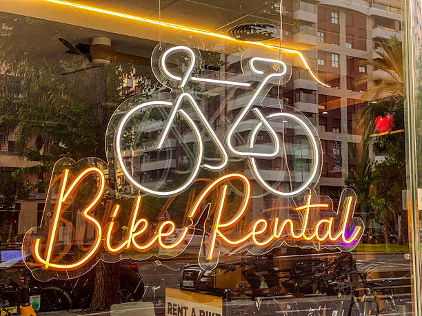 red neon tube bike rental sign